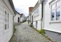 Traditional cobblestone street with wooden houses in the old town of Stavanger, Norway