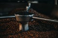 Traditional coffee roaster cooling of fresh roasted