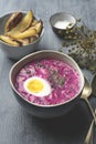 Traditional cold Lithuanian borscht or Saltibarscai with baked potatoes. Kefir summer diet meals for hot weather Royalty Free Stock Photo