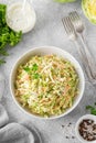 Traditional cole slaw salad in a bowl on a gray concrete background. Salad with cabbage, carrot and mayonnaise sauce. Royalty Free Stock Photo