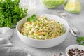 Traditional cole slaw salad in a bowl on a gray concrete background. Salad with cabbage, carrot and mayonnaise sauce. Royalty Free Stock Photo