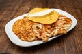 Traditional Colombian breakfast - Grilled chicken, arepa, cheese, fried egg and reheated beans with rice