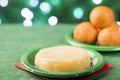 Traditional Colombian bunuelos Deep Fried Cheese Bread and natilla on christmas. Lights Royalty Free Stock Photo