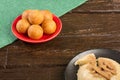 Traditional Colombian bunuelos Deep Fried Cheese Bread and natilla on christmas Royalty Free Stock Photo