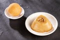 Traditional Colombian bunuelos Deep Fried Cheese Bread and natilla. Text space Royalty Free Stock Photo