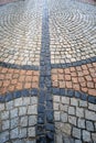 Traditional color stone pavement in perspective after the rain. Abstract background of old cobblestone pavement Royalty Free Stock Photo