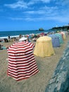 Traditional and colored beach tents on daily rental for tourists.