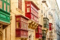 Traditional colorful balconies in old town of Valletta, Malta. Architecture background Royalty Free Stock Photo