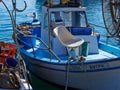Traditional colorful Cypriot fishing boat in clear blue water Paphos Cyprus