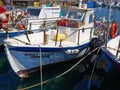 Traditional colorful Cypriot fishing boat in clear blue water Paphos Cyprus