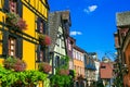 Traditional colorful half-timbered house in Alsace.. Riquewihr village, France Royalty Free Stock Photo