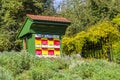 Traditional colorful and picturesque wooden bee hive in Slovenia