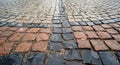Traditional colorful wet stone pavement in perspective Royalty Free Stock Photo