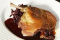 traditional confit french crispy skin on duck leg with braised red cabbage