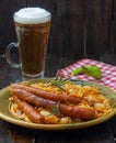 Traditional cooked sauerkraut with sausages and beer Royalty Free Stock Photo