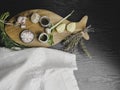 traditional cooking ingredients for fish as lemon, garlic, olive oil, Himalayan salt, pepper, fresh herbs on black wooden Royalty Free Stock Photo