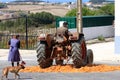 Traditional corn grinding with tractor, Portugal Royalty Free Stock Photo