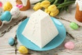 Traditional cottage cheese Easter paskha and dyed eggs on white wooden table Royalty Free Stock Photo