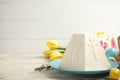 Traditional cottage cheese Easter paskha and dyed eggs on white wooden table, space for text Royalty Free Stock Photo