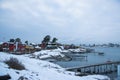 Traditional cottages on the islands around Oslo Norway during the winter overlooking the sea and the Fjord in snow condition Royalty Free Stock Photo