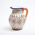 Traditional Craftsmanship: Blue And Orange Painted Earthenware Jug On White Background