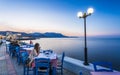 Traditional Cretan Food Restaurant at Paraliaki promenaad at sunset in Kissamos, Crete, Greek Islands, Greece, Europe Royalty Free Stock Photo