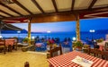 Traditional Cretan Food Restaurant at Paraliaki promenaad at sunset in Kissamos, Crete, Greek Islands, Greece, Europe Royalty Free Stock Photo