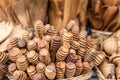 Traditional Cretan handmade olive wood honey dipper objects made of olive wood, souvenir market store.