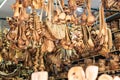 Traditional Cretan handmade olive wood kitchen tableware objects made of olive wood, souvenir market store.