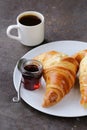 Traditional croissants with jam for breakfast