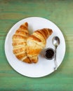 Traditional croissants with jam for breakfast