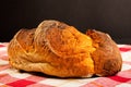 Traditional crusty bread on tablecloth