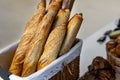 Traditional crusty French bread baguette in basket at bakery. Fresh organic pastry at local market. France cuisine background Royalty Free Stock Photo