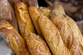 Traditional crusty French bread baguette in basket at bakery. Fresh organic pastry at local market. France cuisine background