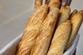 Traditional crusty French bread baguette in basket at bakery. Fresh organic pastry at local market. France cuisine background Royalty Free Stock Photo