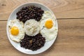 Traditional Cuban cuisine, black beans, rice and fried eggs Royalty Free Stock Photo