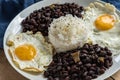 Traditional Cuban cuisine, black beans, rice and fried eggs Royalty Free Stock Photo