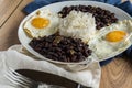 Traditional Cuban cuisine, black beans, rice and fried eggs Royalty Free Stock Photo