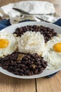 Traditional Cuban cuisine, black beans, rice and fried eggs Royalty Free Stock Photo