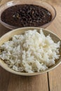 Traditional Cuban cuisine, black beans and rice in two clay bowls Royalty Free Stock Photo