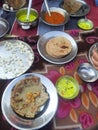 Traditional Cuisine Kadhi or Bajra Roti served in a village in Rajasthan.