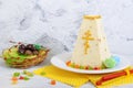 Traditional curd Easter cake with candied fruits and chocolate eggs on the holiday light background. Easter cottage cheese dessert Royalty Free Stock Photo