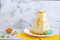 Traditional curd Easter cake with candied fruits on the holiday light background Royalty Free Stock Photo