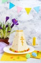 Traditional curd Easter cake with candied fruits and spring flowers crocus on the holiday light background. Easter cottage cheese Royalty Free Stock Photo