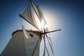 Traditional cycladic windmill against a deep blue sky in a beautiful summer day on Paros island, Cyclades, Greece Royalty Free Stock Photo