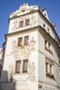 Traditional Czech architecture. Hotel Aurus. Inscription in czech: house near the golden well.