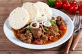 Traditional czech goulash with dumplings on table Royalty Free Stock Photo
