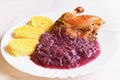 Traditional Czech homemade holiday food. Roast duck with cabbage and potato dumplings Royalty Free Stock Photo