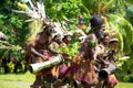 Drummer and dancer together at impressive dance ceremony, New Guinea