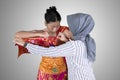 Traditional dancer preparing to wear dresses